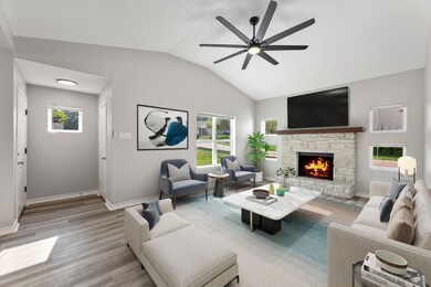 Living room featuring baseboards, a ceiling fan, 