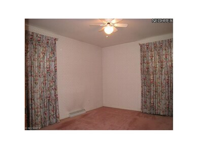 Bedroom #2.  Hardwood flooring is beneath the carpeting.