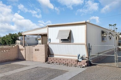View of front of home with fence and a gate