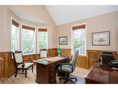 Den. This Spacious paneled study with cathedral ce
