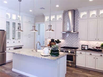Photo is of the Delamar Model kitchen and is for d