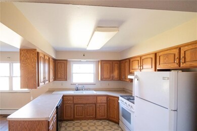 Eat-in kitchen with lots of cabinets 