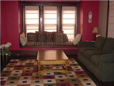 Notice the wooden window seat in this large family