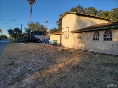 View of side of home with brick siding