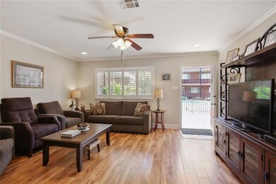 Living Room towards the front door with the pool j