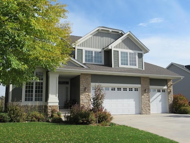 Larger 3 car garage with concrete driveway.