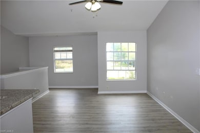 Unfurnished room with ceiling fan, plenty of natur