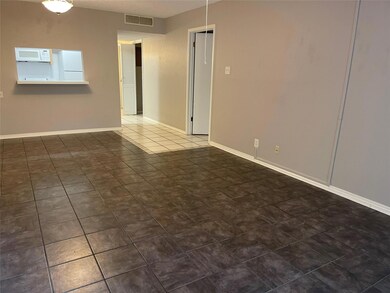 Tiled spare room with baseboards