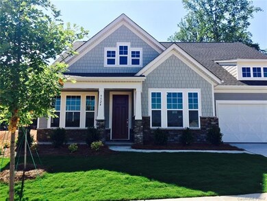 Craftsman style 1.5 story home in Cobblestone Mano