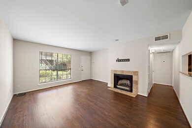 Large living room with wood burning fireplace and