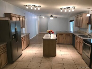 Huge kitchen with lots of cabinets looking at the