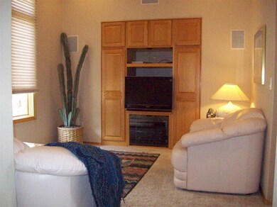 Office built in T.V. shelves and cabinets.