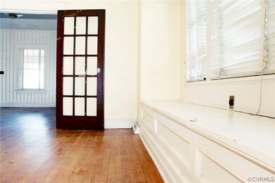 Dining room with built in cubby bench and french doors