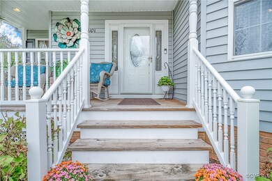 Doorway to property with covered porch