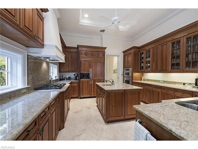 Custom kitchen with gas cooktop and island with pr