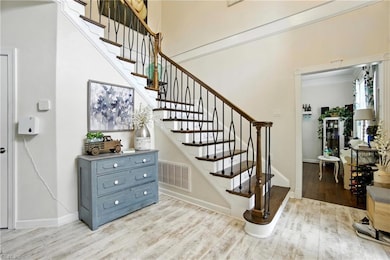 Immediately enter through the expansive foyer to the richly appointed interior
