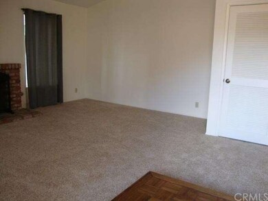 Living room from raised parquet entry.  Slated doo