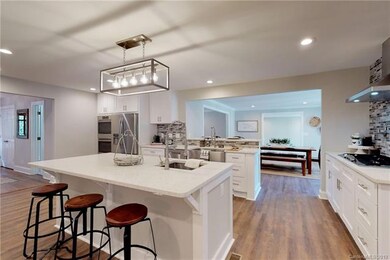Large island /breakfast bar. Open to Dining Area. 