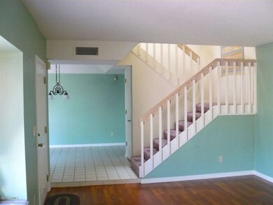 Stairs to Bedrooms and entrance to DInin