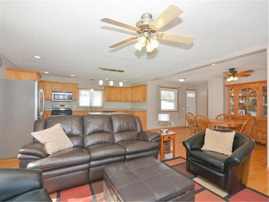 Family room is made cozy with a gas fireplace buil