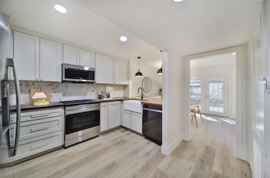 Kitchen with new stainless steel appliances. (Stag