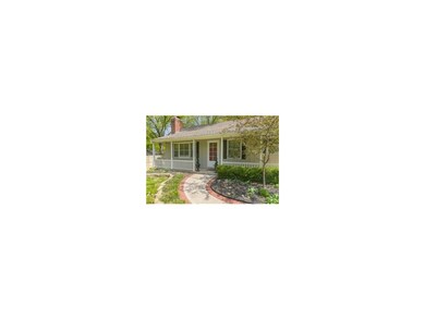 The brick lined walkway leads you to the home and 