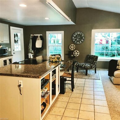 A work space at the end of the kitchen island make