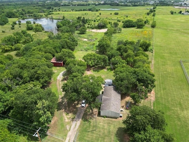 Aerial view of sparsely populated area featuring a large body of water