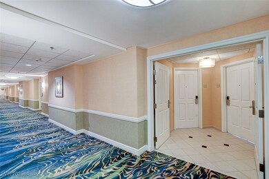 Corridor featuring light tile patterned floors, a