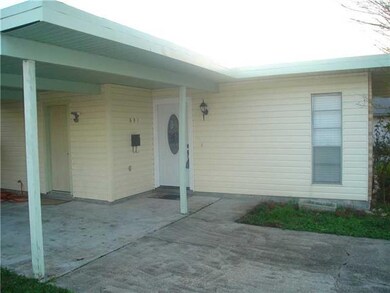 View. View of front door under carport.