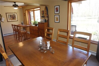 Formal dining room with large windows and French d