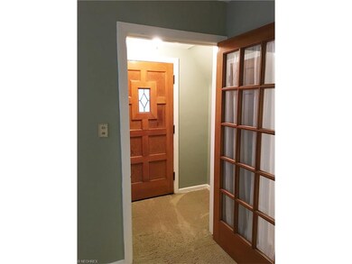 Neutral carpeting throughout and natural woodwork