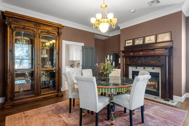 Dining area featuring visible vents, a fireplace 