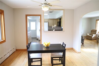 Dining room adjacent to living room and kitchen.