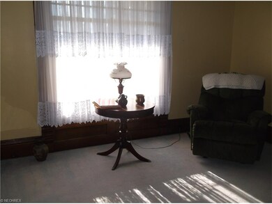 The Parlor Room off the entry way is additional li