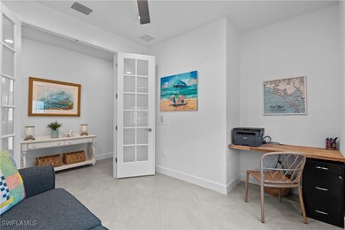 Home office with baseboards and light tile pattern