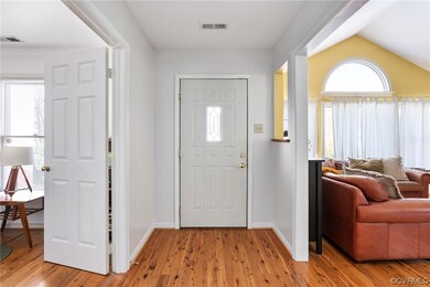 Foyer entrance with lofted ceiling, plenty of natu