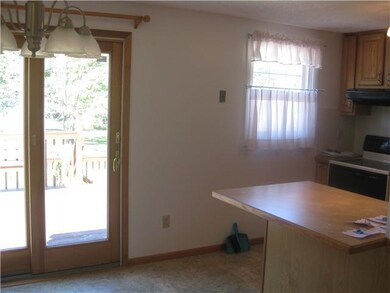Kitchen large eating area with door to 3 tiered de