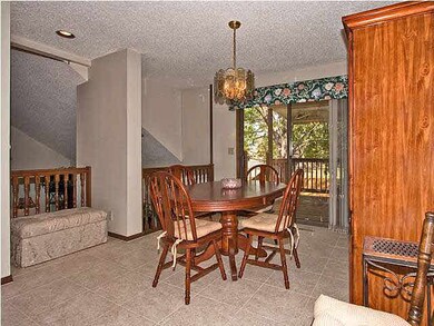 Formal dining area...doors open onto covered deck