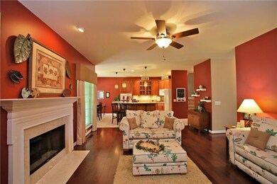 Family/keeping room open for casual entertaining with new hardwood floors and gas starter wood burning fireplace.
