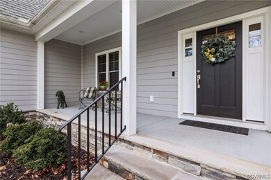Entrance to home featuring an inviting front porch