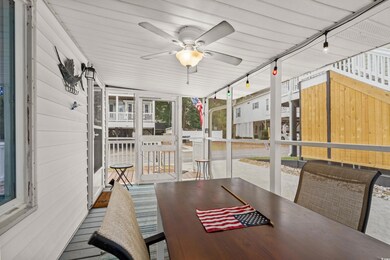 Sunroom featuring ceiling fan