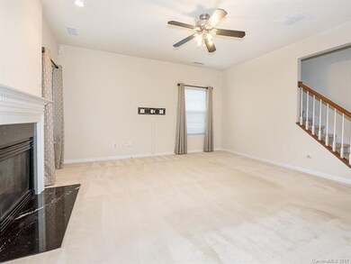 Family Room with fireplace and ceiling fan