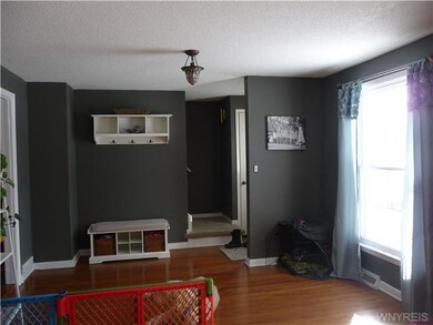 Living Room nice entry hall coming in with coat cl