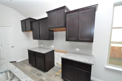 Kitchen - Photos are of a similarly finished home.