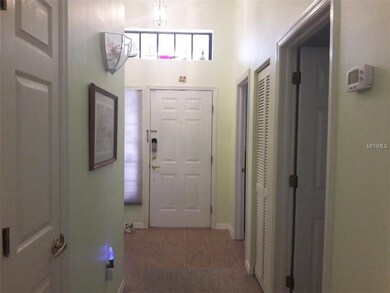 ENTRY FOYER WITH TRANSOM WINDOW.