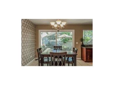 This eat-in kitchen is bright & cheerful with lots