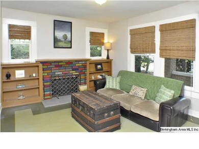 Spacious living room has lots of windows letting i