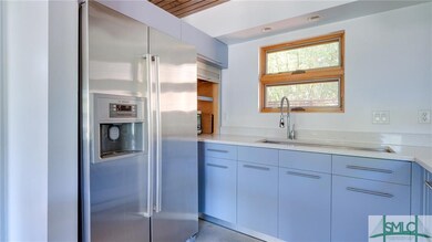 Note the unique cabinets with appliance garage nex