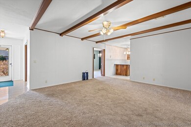 Den looking back toward front living room and kitchen